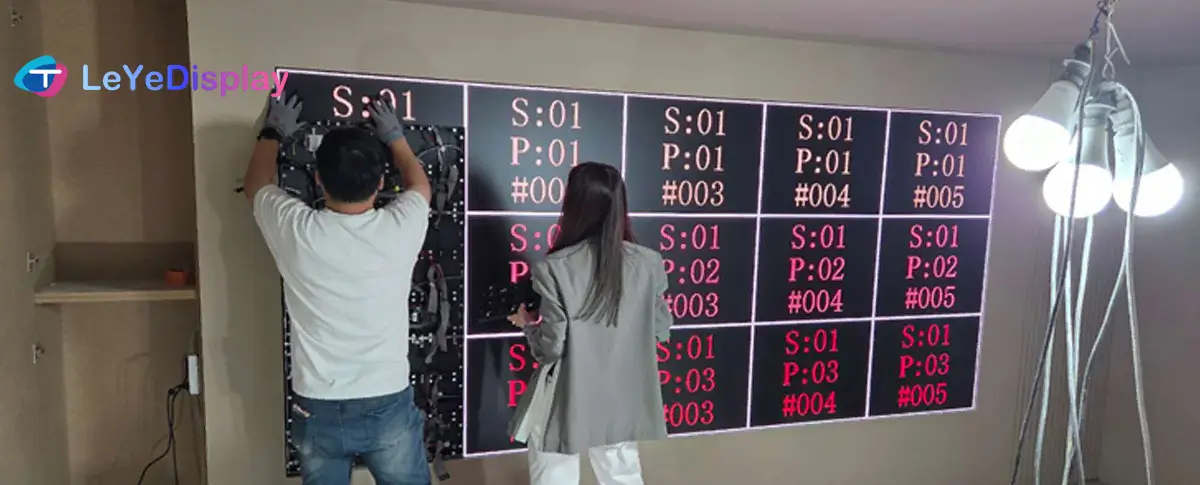 LED display cabinet installation and precision alignment during on-site commissioning.